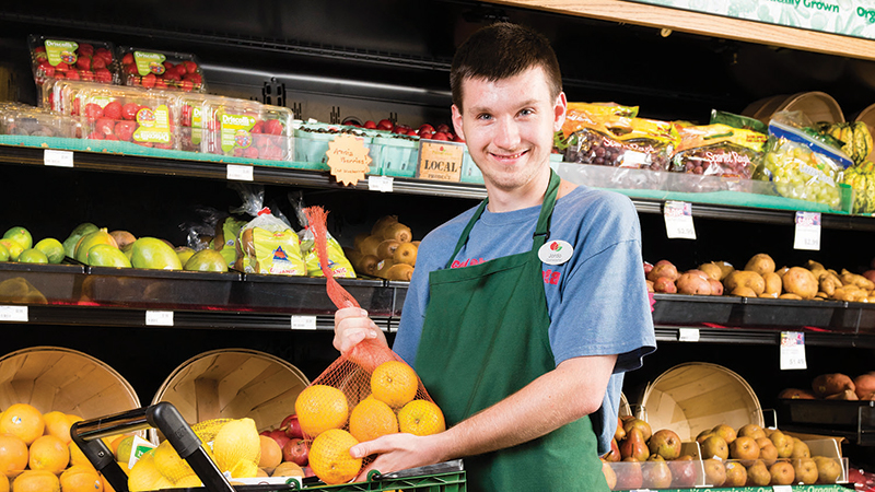 LifeScape client working at a grocery store